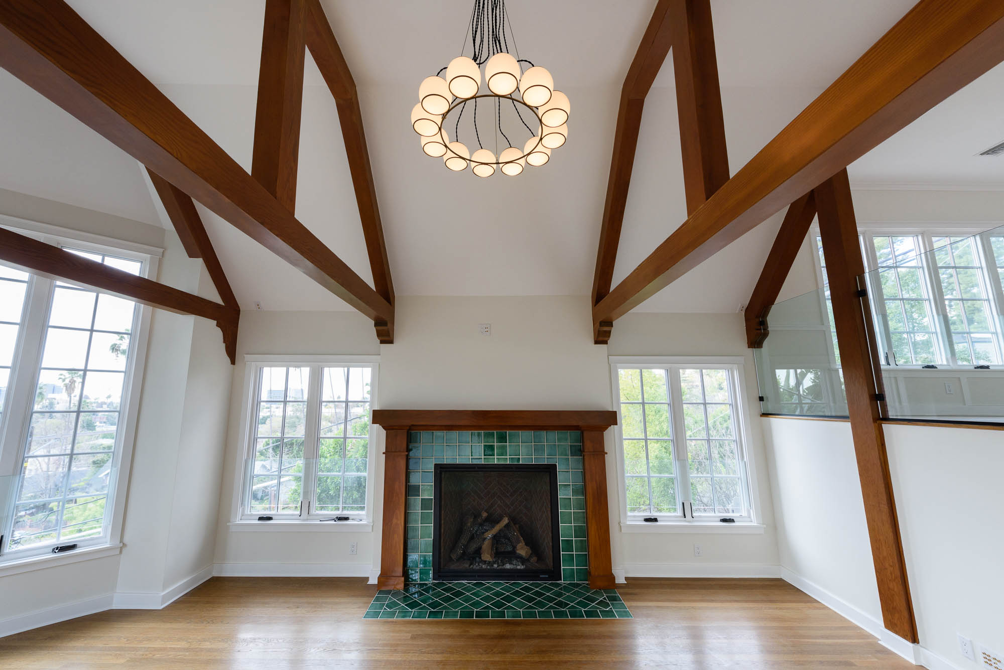  Stunning airy and open with high vaulted ceiling and wood beams • Solid light oak floors 